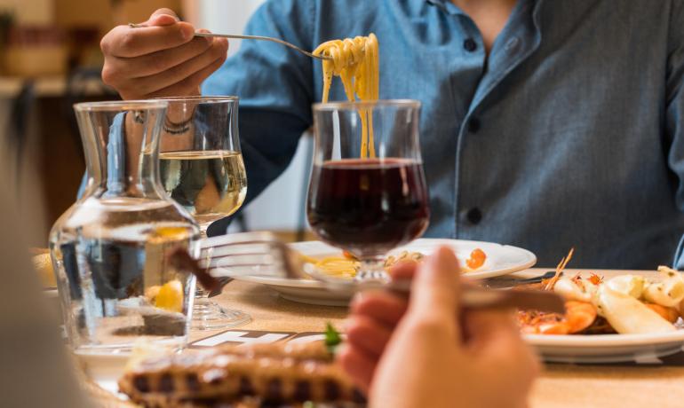Dinner with pasta, red and white wine.