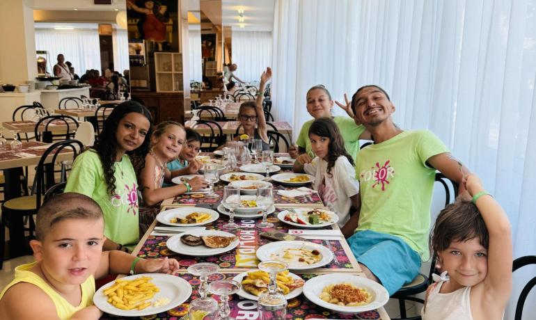 Group of people dining at a colorful restaurant.