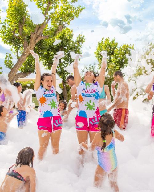 People enjoying an outdoor foam party.