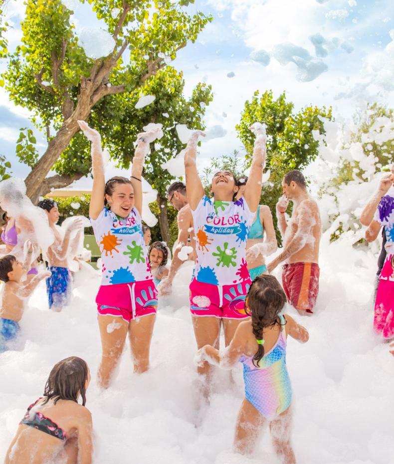 People having fun at an outdoor foam party.