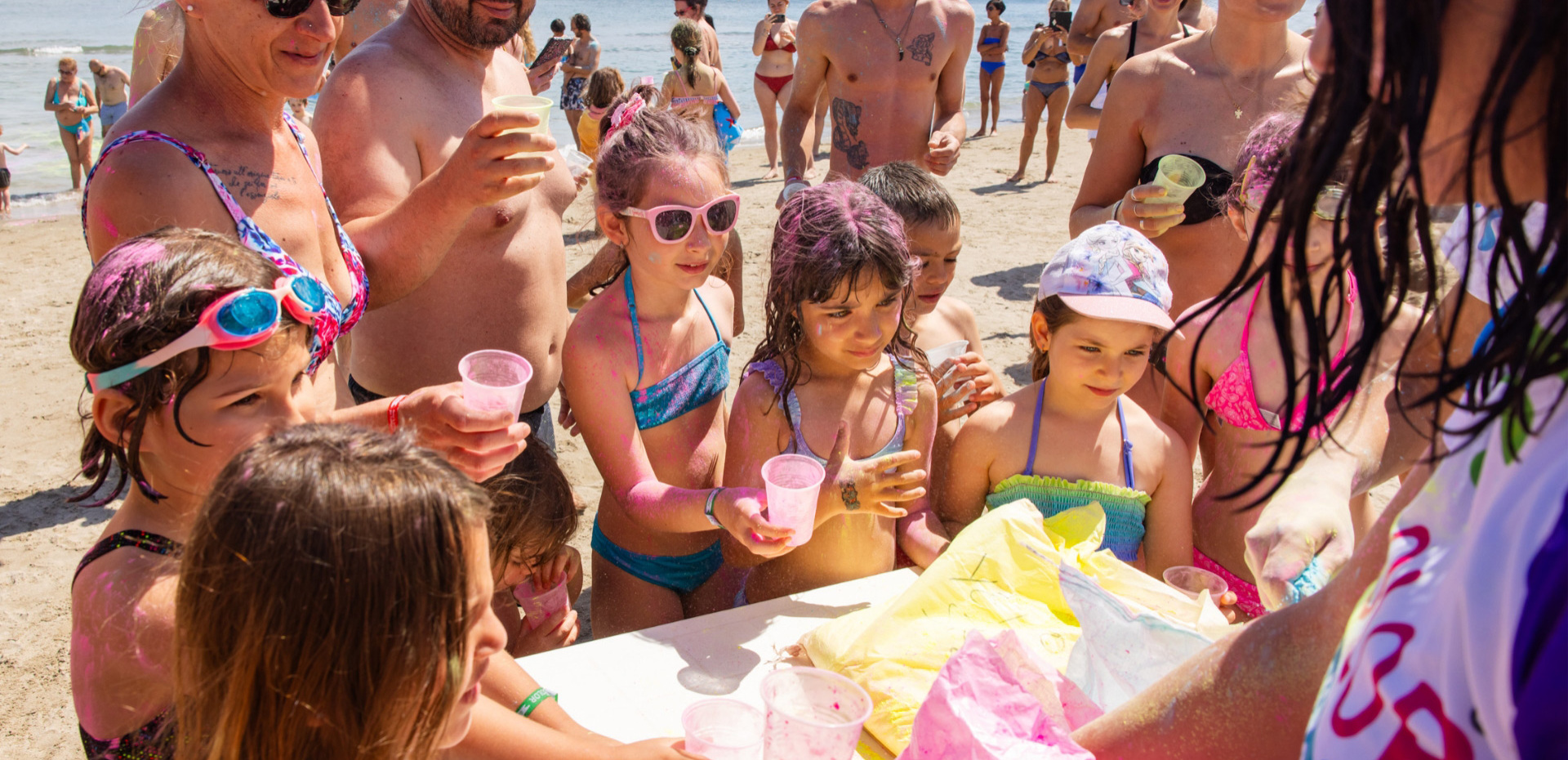 Happy children play on the beach, colorful and smiling.