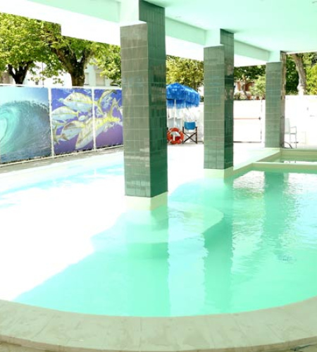 Bright pool, green columns, relaxing and fresh atmosphere, sky and nature around.