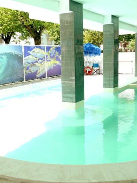 Bright pool, green columns, relaxing and fresh atmosphere, sky and nature around.